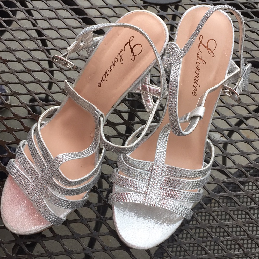 I am selling silver rhinestoned heels size 7.